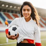 Portrait latin american girl soccer player high performance athlete soccer stadium